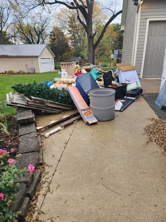 Dumpster being loaded with debris for Demolition Dumpster Rental in Shenandoah